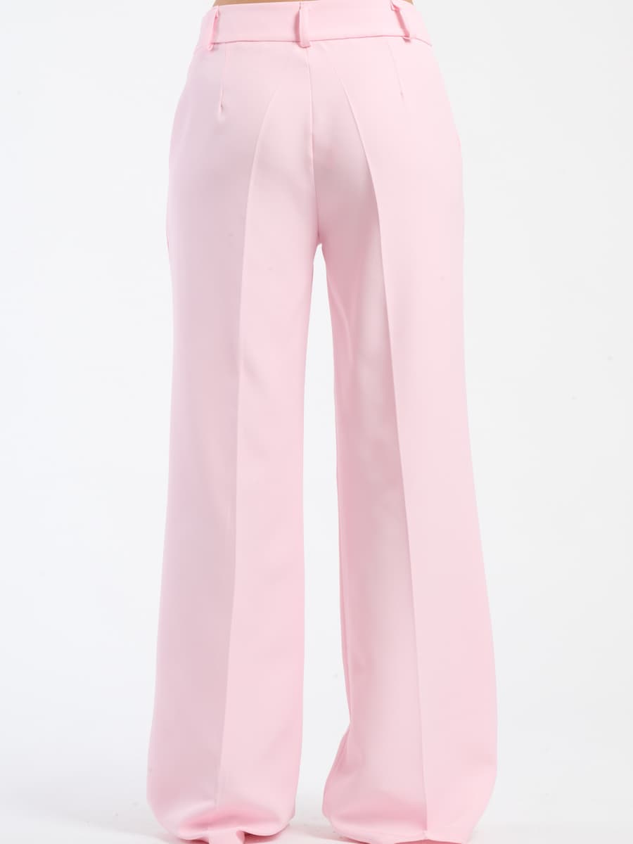 Pantaloni rosa baby fluidi con chiusura a bottoni, vivaci e confortevoli.