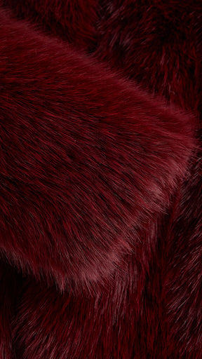 Giacca cropped in pelliccia sintetica con cappuccio ampio