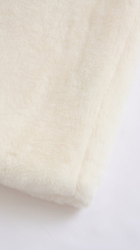 Cappotto medio in peluche sintetica con colletto a revers