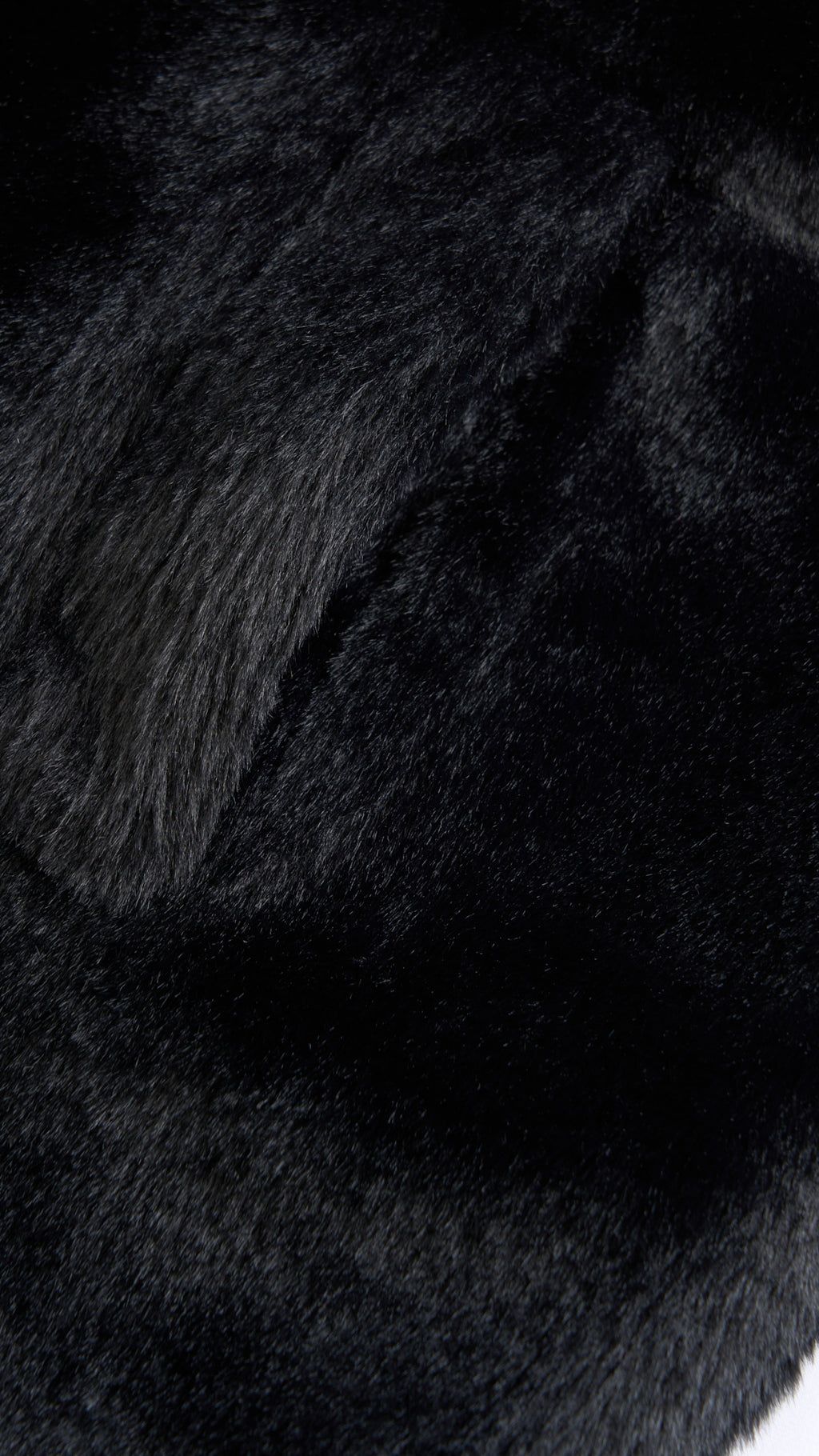 Cappotto medio in peluche sintetica con colletto a revers