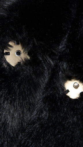 Cappotto medio in peluche sintetica con colletto a revers