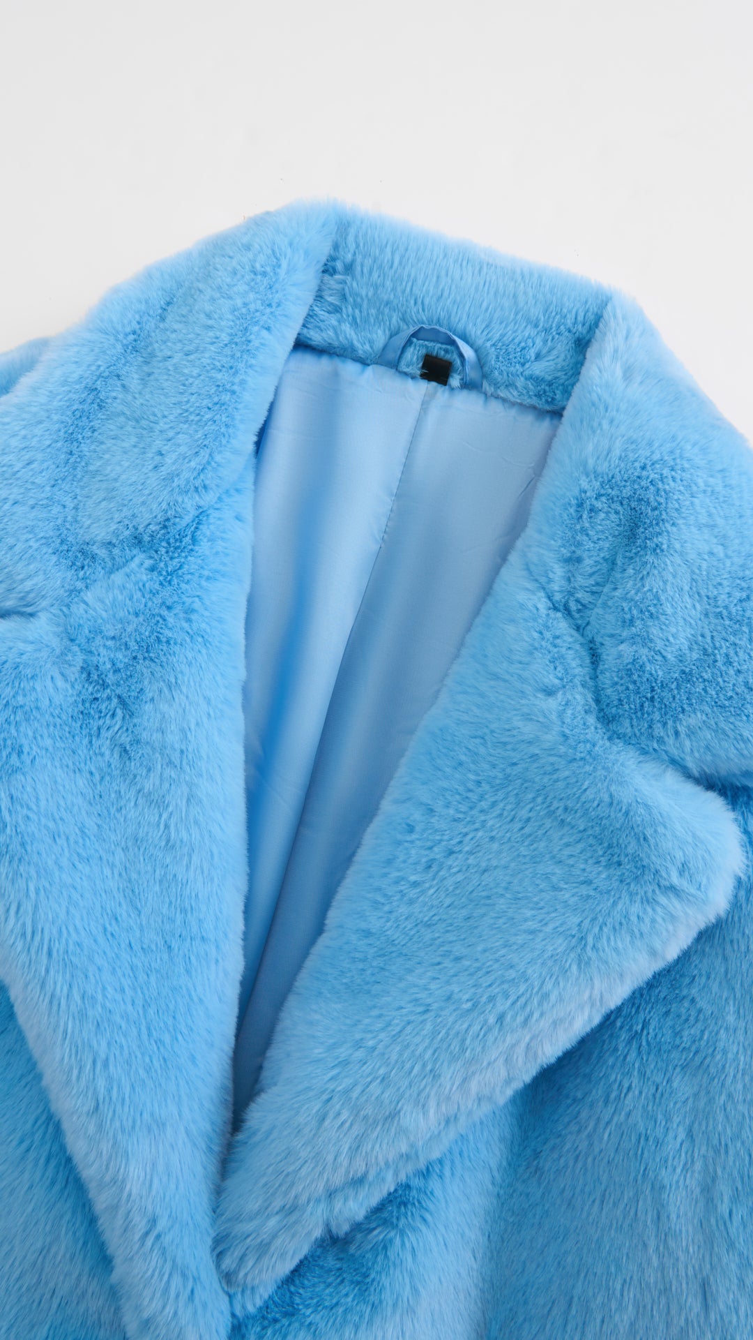 Cappotto lungo in peluche sintetica con colletto a revers
