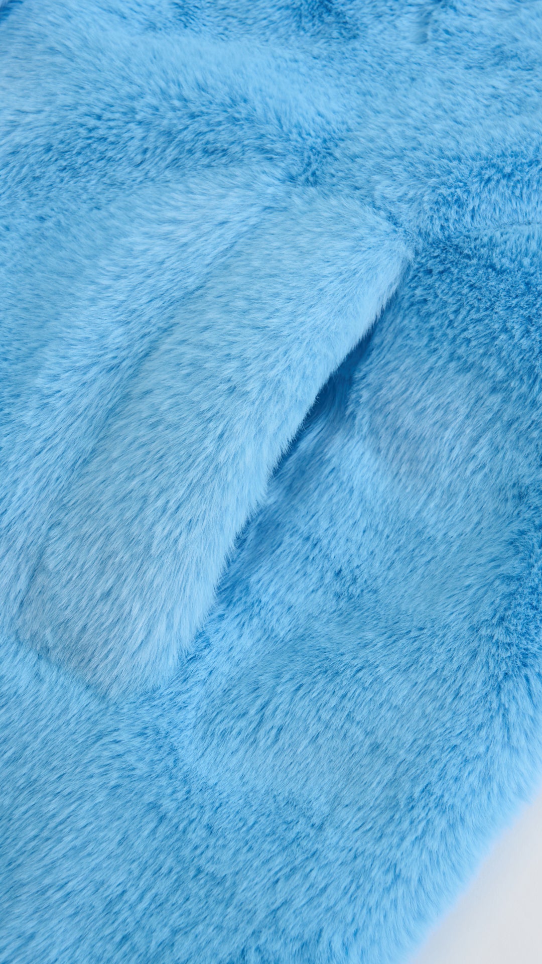 Cappotto lungo in peluche sintetica con colletto a revers