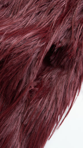 Cappotto corto in pelliccia sintetica a frange con cintura