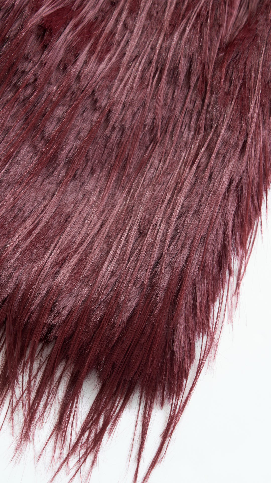 Cappotto corto in pelliccia sintetica a frange con cintura