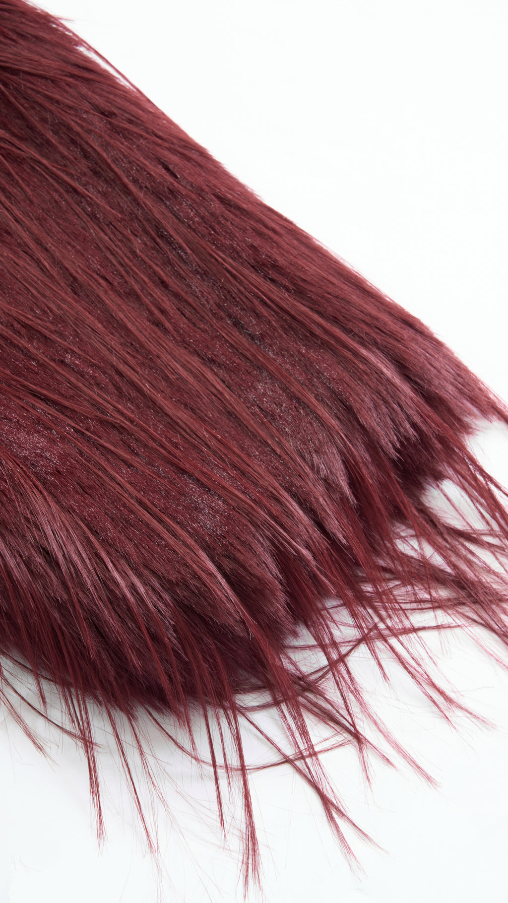 Cappotto corto in pelliccia sintetica a frange con cintura