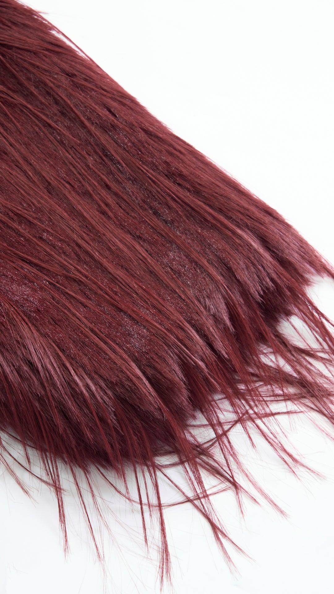 Cappotto corto in pelliccia sintetica a frange con cintura