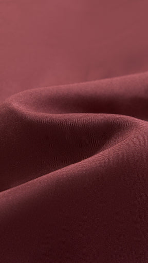 Cappotto corto in pelliccia sintetica a frange con cintura