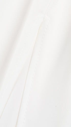 Abito lungo elegante con scollo a collo alto a fiocco, design bicolore con top asimmetrico e gonna fluida