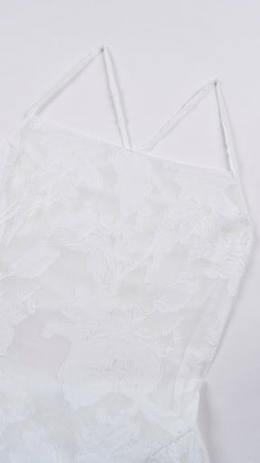 Abito midi elegante a spalline sottili con scollo a fascia, tessuto jacquard floreale e dettaglio a croce sul retro