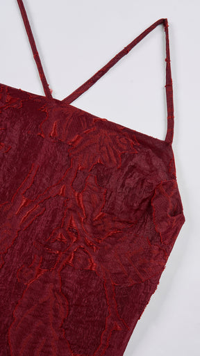 Abito midi elegante a spalline sottili con scollo a fascia, tessuto jacquard floreale e dettaglio a croce sul retro