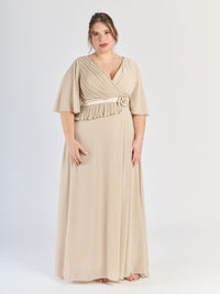 Abito elegante beige per eventi, con design avvolgente e fiocco