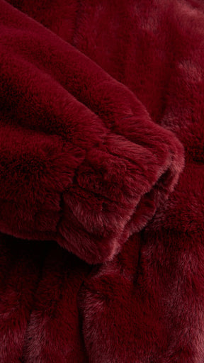 Giacca con cappuccio in peluche sintetica con zip e coulisse