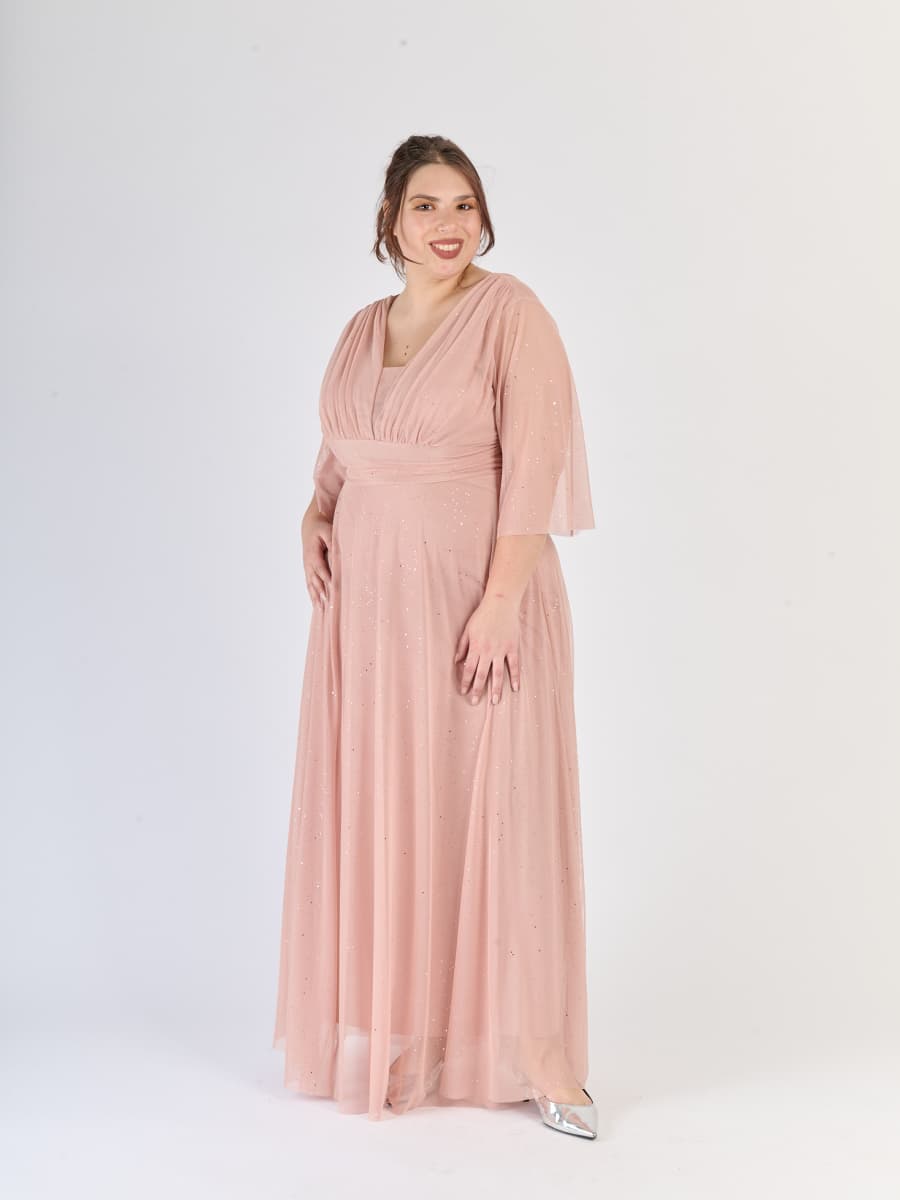 Lungo abito rosa antico dal design nostalgico, maniche trasparenti e scollatura a V, per eventi affascinanti.