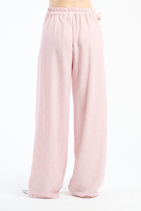 Pantaloni larghi rosa con coulisse e nodo, dolcezza e femminilità.