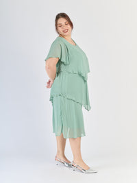 Salvia dress con tre livelli distinti, maniche trasparenti e atmosfera vegetale