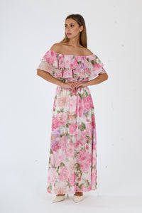 Vestito fuxia a fiori con taglio a bardot e gonna dritta, ideale per eventi formali e serate glamour.