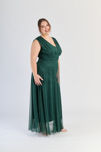 Vestito verde.S fluviale, colletto a V e fascia in vita, energiaverde pura.