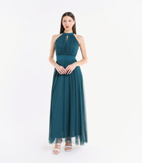 Abito ottanio elegante, design halter, gonna fluida, pianta verde decorativa