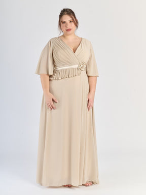 Abito elegante beige per eventi, con design avvolgente e fiocco
