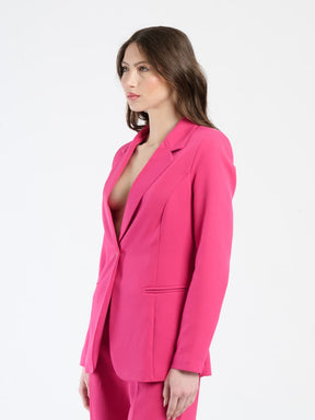 Ensemble fuxia: blazer con colletto a V e pantaloni, stile sexy e moderno.