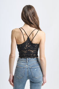 Canotta di pizzo nero, colletto a V e silhouette seducente