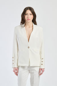 Camicia bianca con maniche gigot e cerniera laterale.