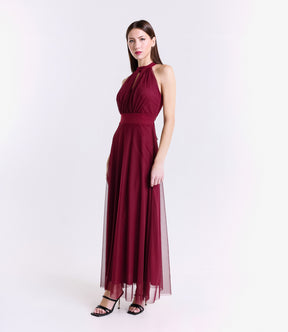 Abito vino rosso elegante, design halter, gonna fluida, pianta verde decorativa