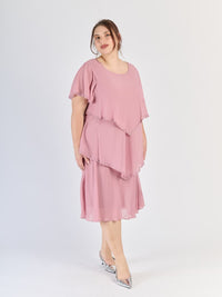 Vestito rosa antico da sera, silhouette avvolgente con strati e maniche svettanti